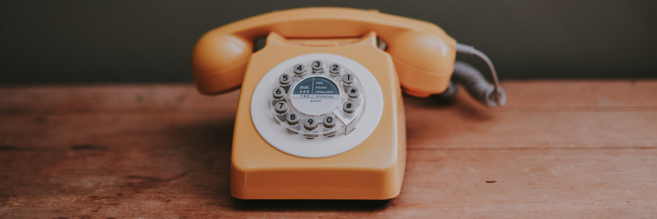 Old style telephone on table